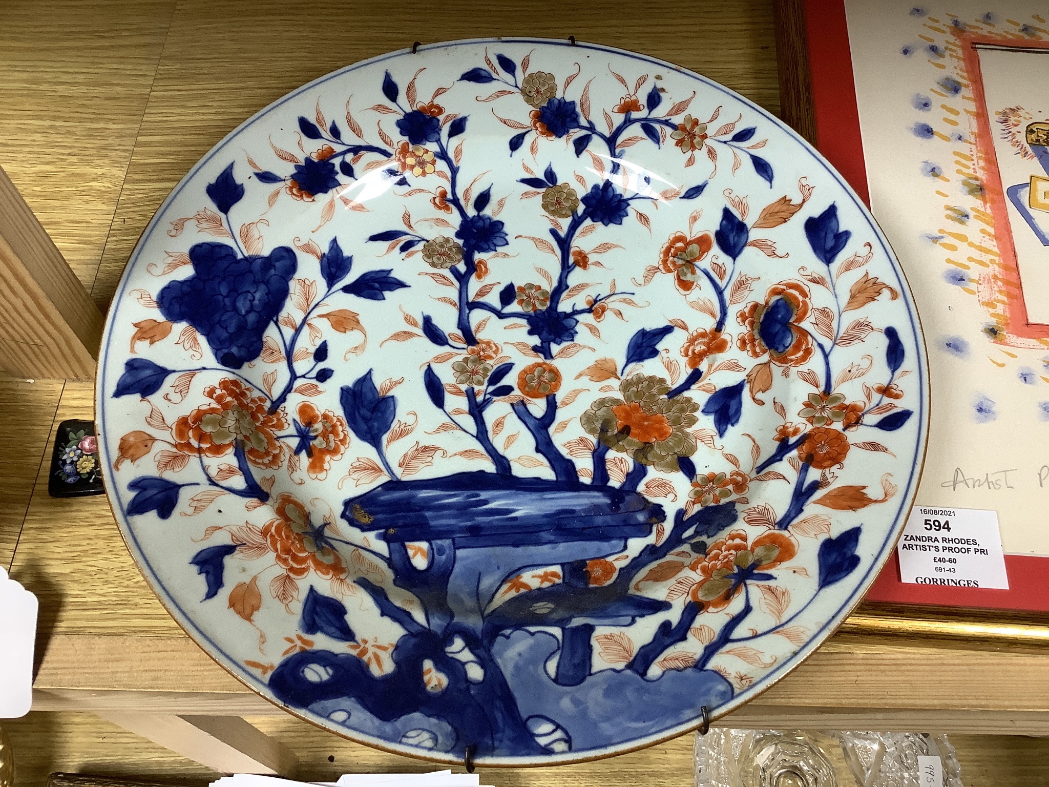 Three Japanese Imari plates together with a larger dish, 18th century, diameter 32cm